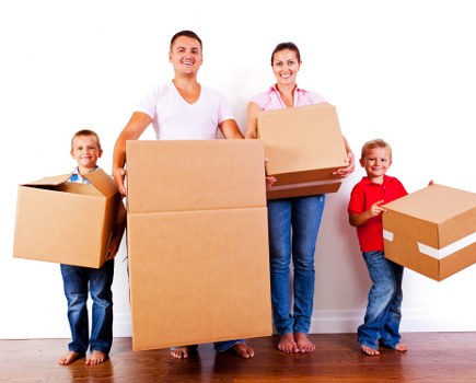 Moving team loading items safely with protective measures in place