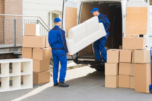 Removal team planning a move in Ickenham with packed boxes and a van