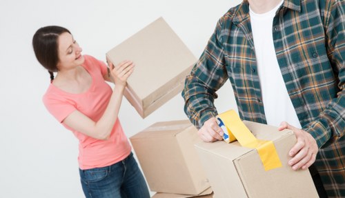 Local packing team organising fragile household items in Ickenham
