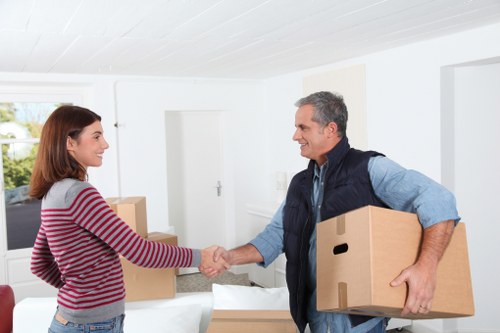 Moving team carrying household furniture from an Ickenham property