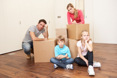 Professional movers handling furniture and boxes for a home relocation